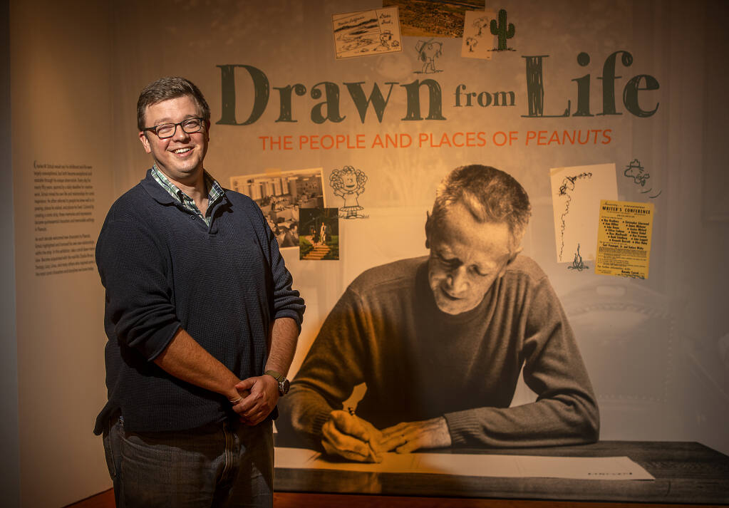 Curator Benjamin Clark spent nearly a year putting together the current Charles M. Schulz Museum exhibit “Drawn from Life: The People and Places of Peanuts,” which explores the real-life people, places and events – many in Sonoma County – that inspired “Peanuts” creator Charles Schulz. (John Burgess/The Press Democrat)