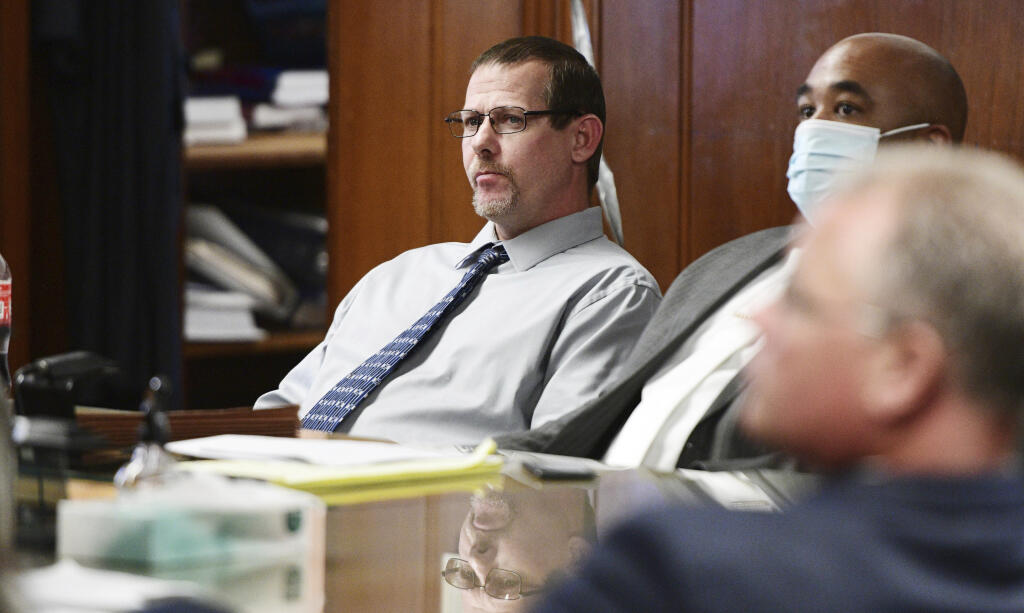 Pete Musico, left, appears before Jackson Circuit Judge Thomas Wilson for trial in a courthouse, on Tuesday, Oct. 4, 2022, in Jackson, Mich. Paul Bellar, Joseph Morrison and Musico are accused of being involved in a plot in 2020 to kidnap Michigan Gov. Gretchen Whitmer. All were members of the Wolverine Watchmen, a paramilitary group that trained in the Jackson area. (J. Scott Park/Jackson Citizen Patriot via AP, Pool)