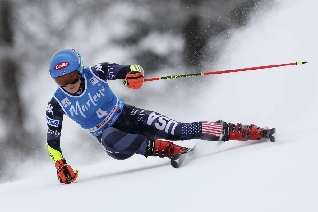 United States' Mikaela Shiffrin speeds down the course during an alpine ski, women's World Cup giant slalom, in Kronplatz, Italy, Tuesday, Jan. 24, 2023. American skier Mikaela Shiffrin won a record 83rd World Cup race Tuesday. Shiffrin’s giant slalom victory broke a tie on the all-time women’s list with former American teammate Lindsey Vonn. Vonn retired four years ago when injuries cut her career short. (AP Photo/Alessandro Trovati)