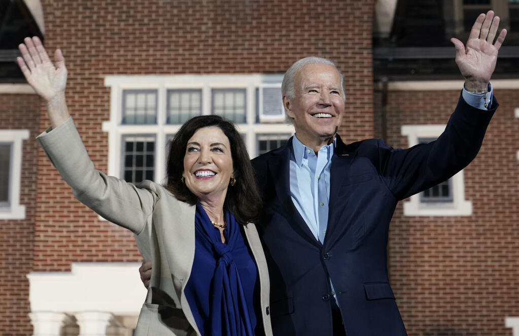 President Joe Biden and New York Gov. Kathy Hochul wave to the crowd during a campaign event Sunday, Nov. 6, 2022, at Sarah Lawrence College in Yonkers, N.Y. (AP Photo/Patrick Semansky)