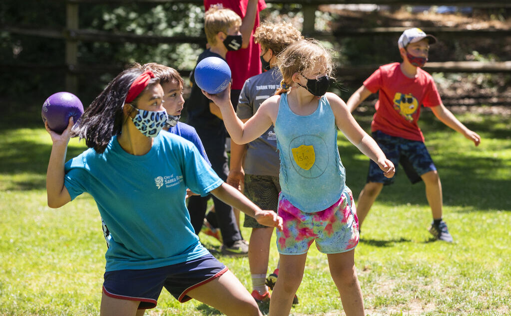 Camp Wa-Tam campers play dodgeball in Howarth Park in Santa Rosa on Thursday, July 15, 2021. (Photo by John Burgess/The Press Democrat)