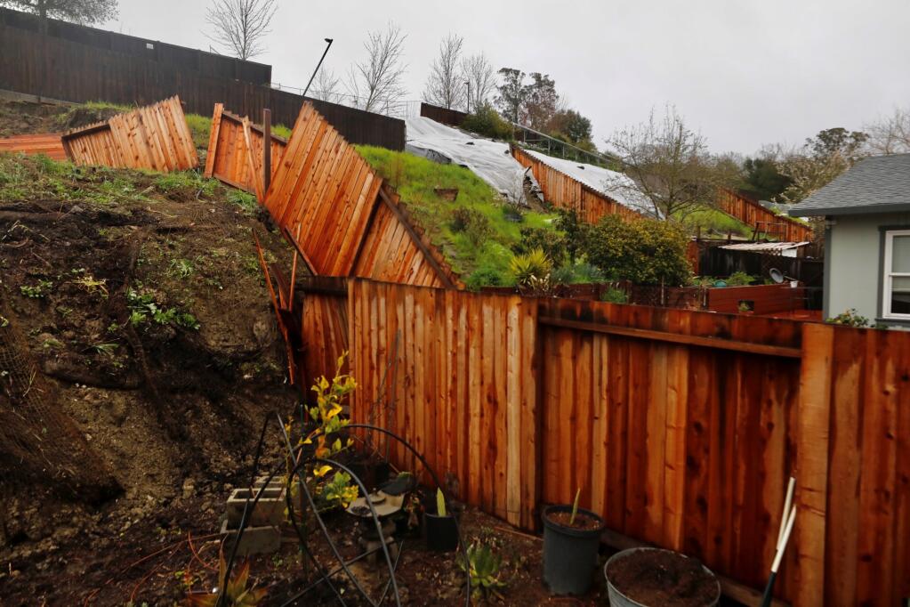 A home on Cooper Drive in Santa Rosa is endangered by shifting soil on a nearby hill, officials said on Sunday, March 12, 2023. Fire officials said the city “red-tagged two properties” and are monitoring another four, including a synogogue as a result of the shifting soil, which was affected by the ongoing rains. (Beth Schlanker / The Press Democrat)