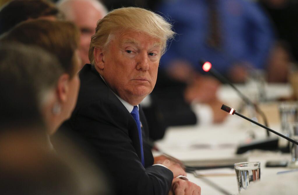 President Donald Trump listens during a 'Made in America,' roundtable event in the East Room of the White House, Wednesday, July 19, 2017, in Washington. (AP Photo/Alex Brandon)