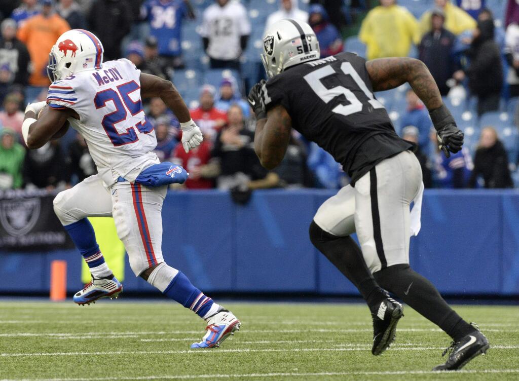 Buffalo Bills running back LeSean McCoy (25) takes off for a long touchdown run as Oakland Raiders outside linebacker Bruce Irvin (51) tries to catch him during the second half Sunday, Oct. 29, 2017, in Orchard Park, N.Y. (AP Photo/Adrian Kraus)