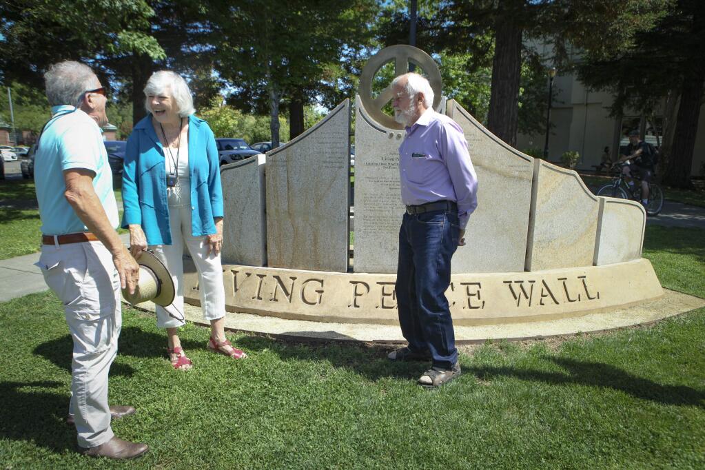 Petalumans Dr. Earl Herr and Congresswoman Lynn Woolsey are honored on the Living Peace Wall in Sebastopol. Standing by the wall with them is Michael Gillotti (far left) who conceived and designed the wall. (CRISSY PASCUAL/ARGUS-COURIER STAFF)