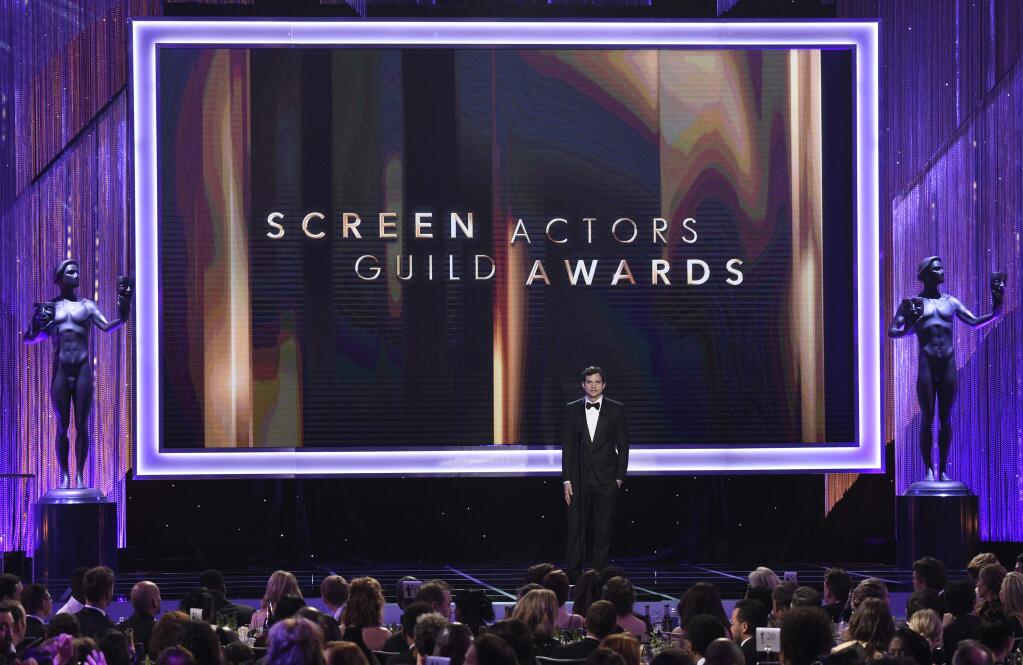 FILE - In this Jan. 29, 2017 file photo, Ashton Kutcher presents the award for outstanding performance by a female actor in a comedy series at the 23rd annual Screen Actors Guild Awards in Los Angeles. The 2018 SAG Awards nominations for achievements in film and television will be announced on Wednesday, Dec. 13. (Photo by Chris Pizzello/Invision/AP, File)