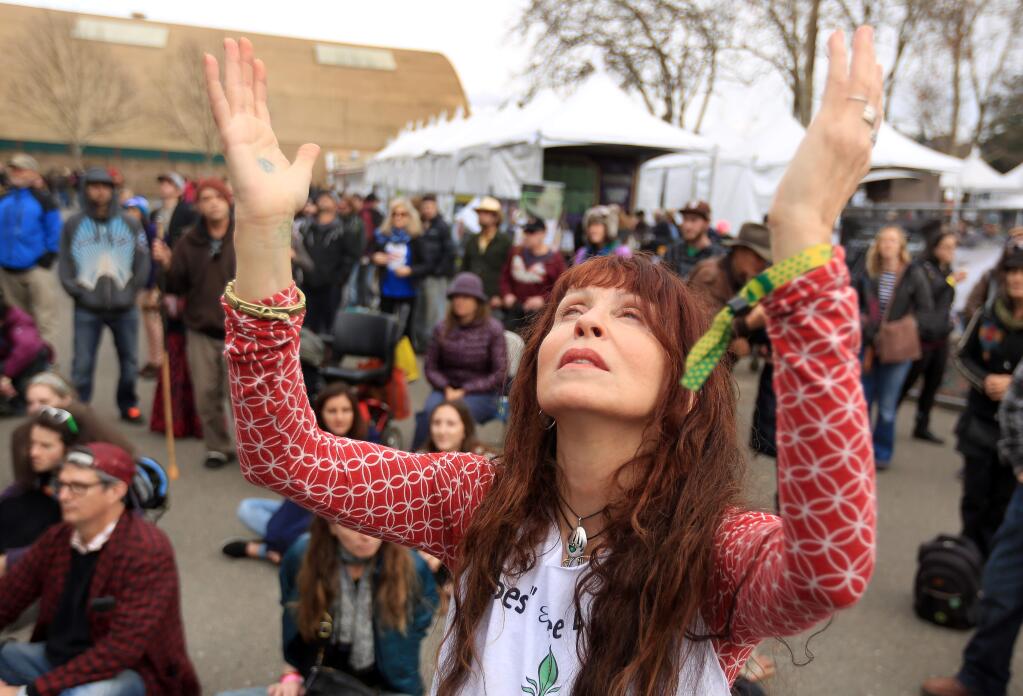 Eileen of Sebastopol, who would not give her last name, dances to live music during the Emerald Cup at the Sonoma County Fairgrounds in Santa Rosa, Sunday Dec. 14, 2014. (Kent Porter / Press Democrat) 2014