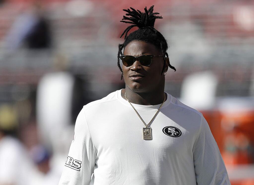 In this Sept. 21, 2017, file photo, injured San Francisco 49ers linebacker Reuben Foster watches before a game against the Los Angeles Rams in Santa Clara. The 49ers are hoping to get the talented rookie linebacker back this week after a sprained ankle sidelined him since the season opener. (AP Photo/Marcio Jose Sanchez, File)