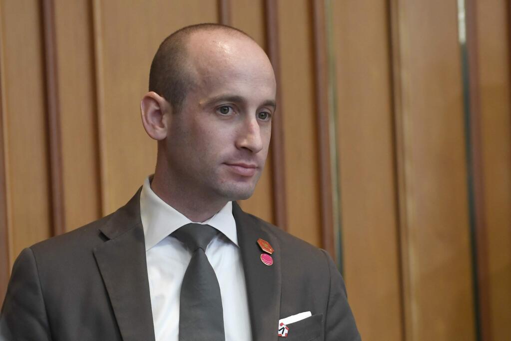 FILE - In a Sunday, June 30, 2019 file photo, White House senior policy adviser Stephen Miller waits for the start of a meeting with President Donald Trump and South Korean President Moon Jae-in in Seoul. The Southern Poverty Law Center has published emails that it says show White House adviser Stephen Miller 'promoted white nationalist literature and racist propaganda' to a conservative news site. The nonprofit's Hatewatch blog published excerpts Tuesday, Nov. 12, 2019 of leaked emails Miller sent to Breitbart editors in 2015 and 2016. (AP Photo/Susan Walsh, File)