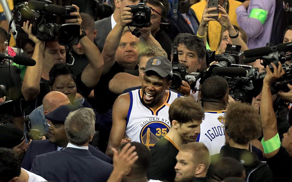 Series MVP Kevin Durant celebrates the Warriors 129-120 victory against the Cavaliers, to claim the NBA crown in game 5 of the NBA Finals, Monday June 12, 2017 in Oakland. (Kent Porter / The Press Democrat) 2017