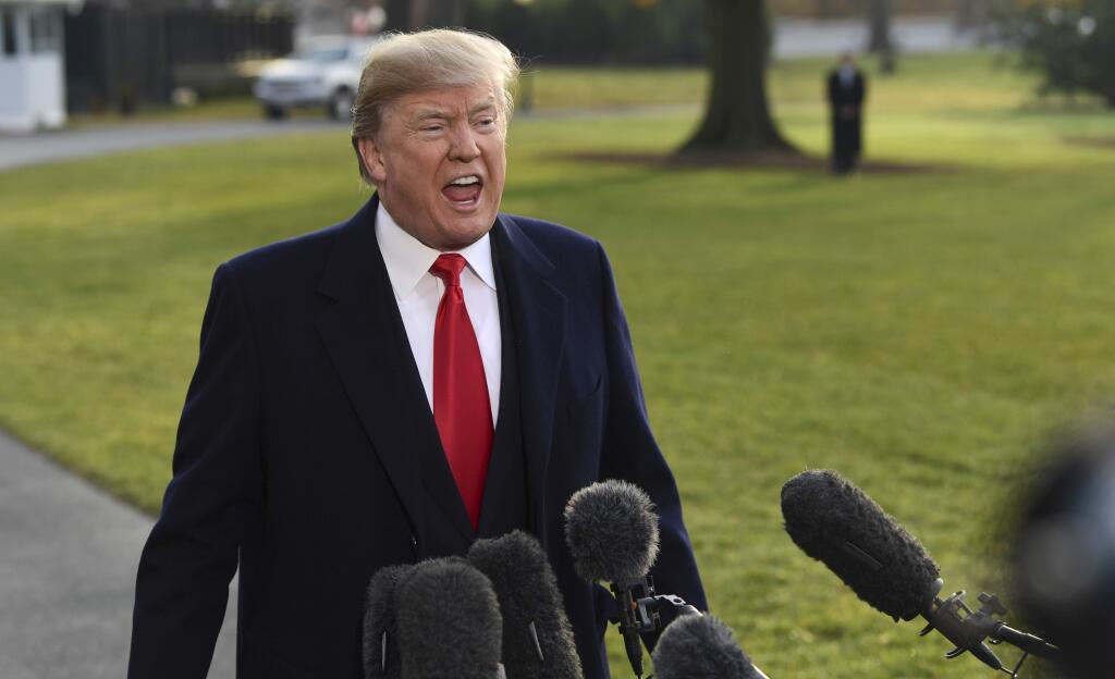 President Donald Trump speaks to reporters before boarding Marine One on the South Lawn of the White House in Washington, Monday, Dec. 4, 2017, before heading to Utah. Trump will be announcing plans to scale back two sprawling national monuments in Utah, responding to what he has condemned as a 'massive federal land grab' by the government. (AP Photo/Susan Walsh)