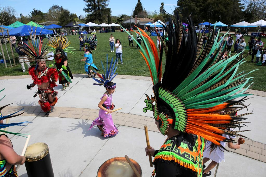 Members of the group Danza Azteca Xantotl perform during the Cesar Chavez Festival at Bayer Farm in Santa Rosa, California on Sunday, March 31, 2019. (BETH SCHLANKER/The Press Democrat)