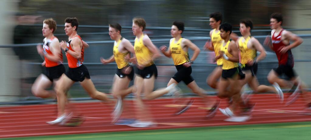 Santa Rosa junior Andrew Engel, second from left, leads the pack to win the 1600m race at Santa Rosa High School on Wednesday. (John Burgess/The Press Democrat)