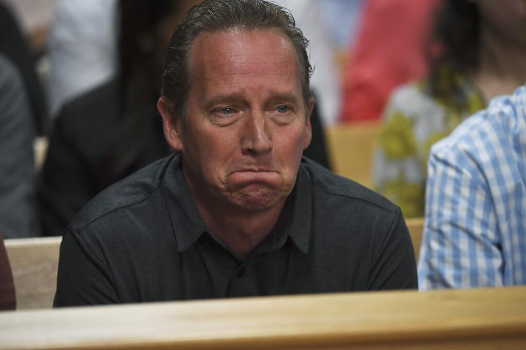 Frank Rzucek the father of Shanann Watts, listens during Christopher Watts' arraignment hearing at the Weld County Courthouse on Tuesday, Aug. 21, 2018 in Greeley, Colo. Watts is charged with first-degree murder in the deaths of his wife, Shanann, and 4-year-old Bella and 3-year-old Celeste. (RJ Sangosti/The Denver Post via AP, Pool)