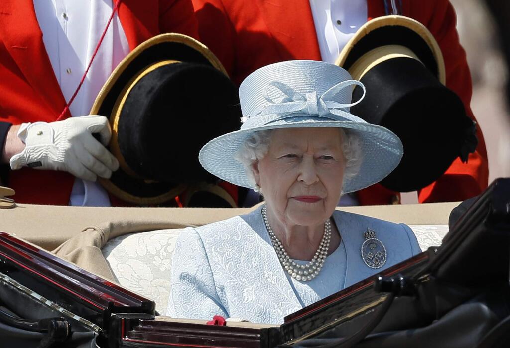 Britain's Queen Elizabeth II leaves Buckingham Palace in a carriage, to attend the annual Trooping the Colour Ceremony in London, Saturday, June 17, 2017. (AP Photo/Kirsty Wigglesworth)