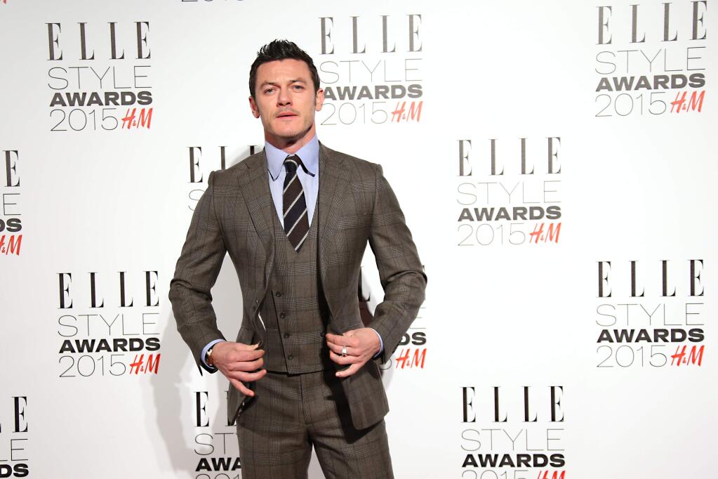 Luke Evans poses for photographers upon arrival for the Elle Style Awards in London, Tuesday, Feb. 24, 2015. (Photo by Joel Ryan/Invision/AP)-