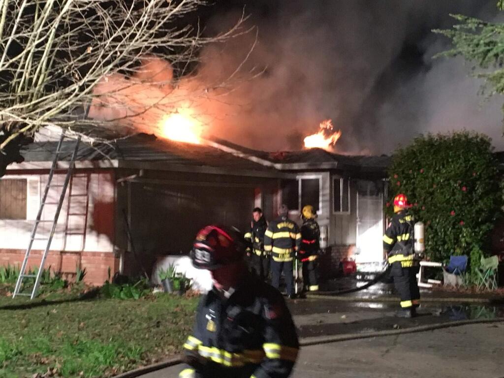 A west Santa Rosa home is engulfed in flames Wednesday, Feb. 20, 2019. Firefighters said they found a body amid the wreckage. (Matt Gustafson)