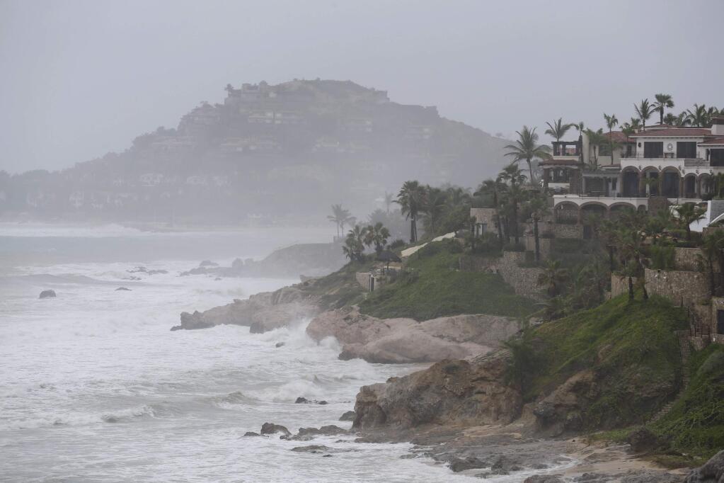 Waves hit the cost of Los Cabos, Mexico, Sunday, Sept. 14, 2014. Hurricane Odile turned into a Category 4 hurricane and it's expected to make a close brush with the southern portion of Mexico's Baja California peninsula Sunday evening. (AP Photo/Victor R. Caivano)