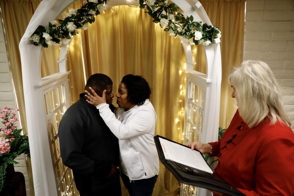 Supervisor Susan Gorin marries Robert Hayes and Tess Coleman at the Sonoma County Clerk's Office in Santa Rosa on Tuesday, Feb. 14, 2017. (Beth Schlanker / Press Democrat)