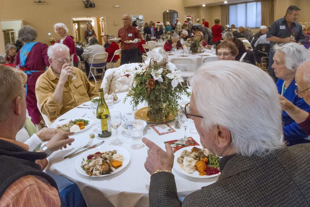 On Christmas Day, Sonoma Valley seniors were invited to VintageHouse senior center to enjoy an elegant sit-down holiday dinner with all the trimmings. Over 100 plates were served at the festive gathering, while over 50 box dinners and shopping bags loaded with goodies were delivered by the Kiwanis to the home bound. (Photo by Robbi Pengelly/Index-Tribune)