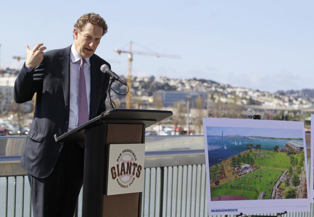 FILE - In this April 4, 2012 file photo, San Francisco Giants President and CEO Larry Baer gestures while announcing plans for a new development project during a news conference at AT&T Park in San Francisco. With the climate ripe for commerce, local organizers think they can make a strong case to bring the 2024 Olympics to San Francisco. After all, the San Francisco Bay Area also is where Google, Apple and Facebook are reshaping the world. It just seems like it's sort of our moment in time for this region to shine on the international stage, said Larry Baer, the chief executive officer of baseballs World Series champion Giants, who is spearheading San Franciscos Olympic bid along with Mayor Ed Lee. (AP Photo/Eric Risberg, File)