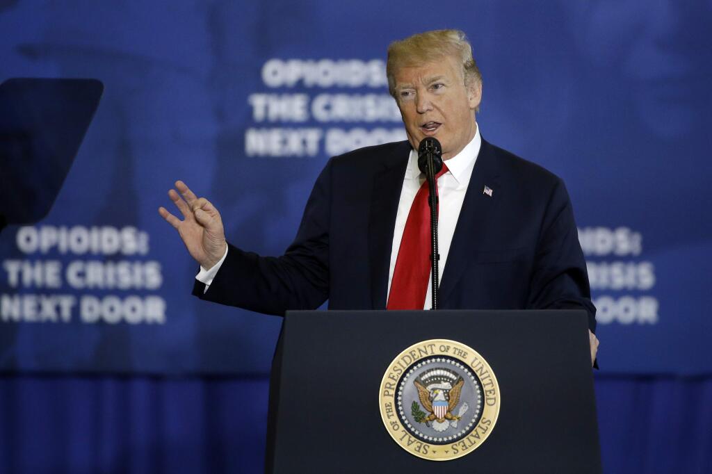 President Donald Trump speaks about his plan to combat opioid drug addiction Monday in Manchester, New Hampshire. (ELISE AMENDOLA / Associated Press)