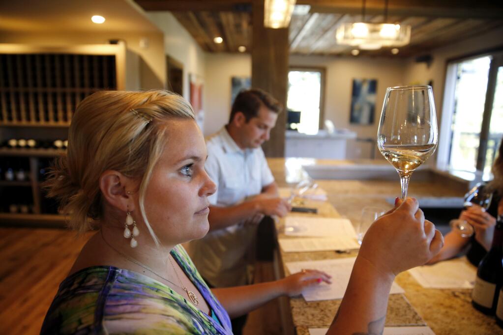 Maura Mazzoni, the manager at the new La Crema tasting room, runs training session for tasting room associates at Saralee's Vineyard in Windsor, on Wednesday, July 20, 2016. (BETH SCHLANKER/ The Press Democrat)