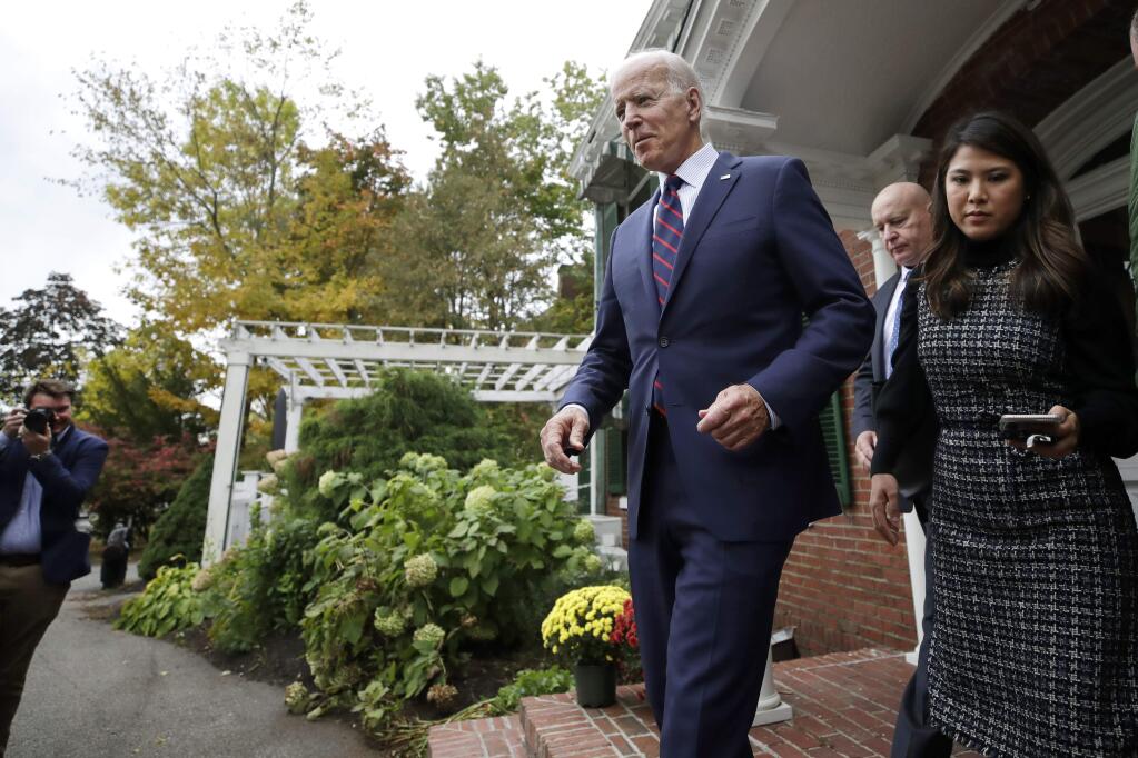 Democratic presidential candidate and former Vice President Joe Biden leaves The Governor's Inn with staff members after a campaign event, Wednesday, Oct. 9, 2019, in Rochester, N.H. (AP Photo/Elise Amendola)