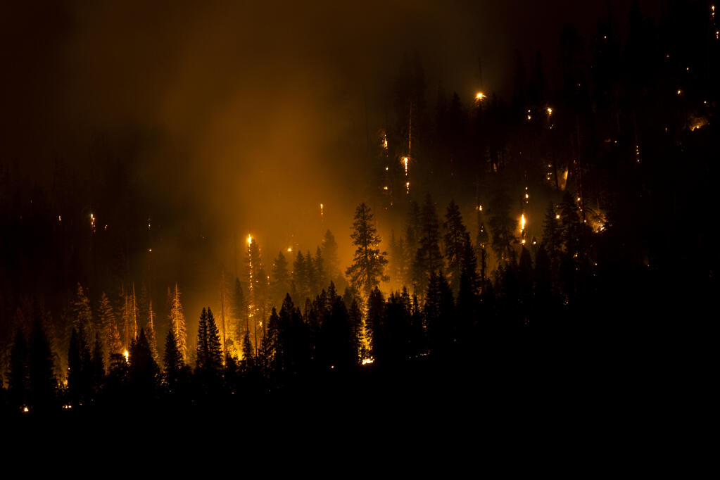 The Washburn Fire burns on a hillside in Yosemite National Park, Calif., Saturday, July 9, 2022. (Stephen Lam/San Francisco Chronicle via AP)