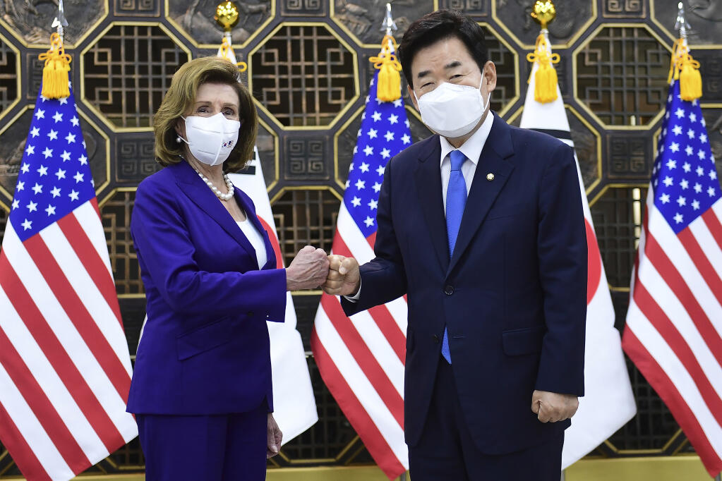 U.S. House Speaker Nancy Pelosi, left, poses with South Korean National Assembly Speaker Kim Jin Pyo before their meeting at the National Assembly in Seoul, South Korea Thursday,  Aug. 4, 2022. (Kim Min-Hee/Pool Photo via AP)
