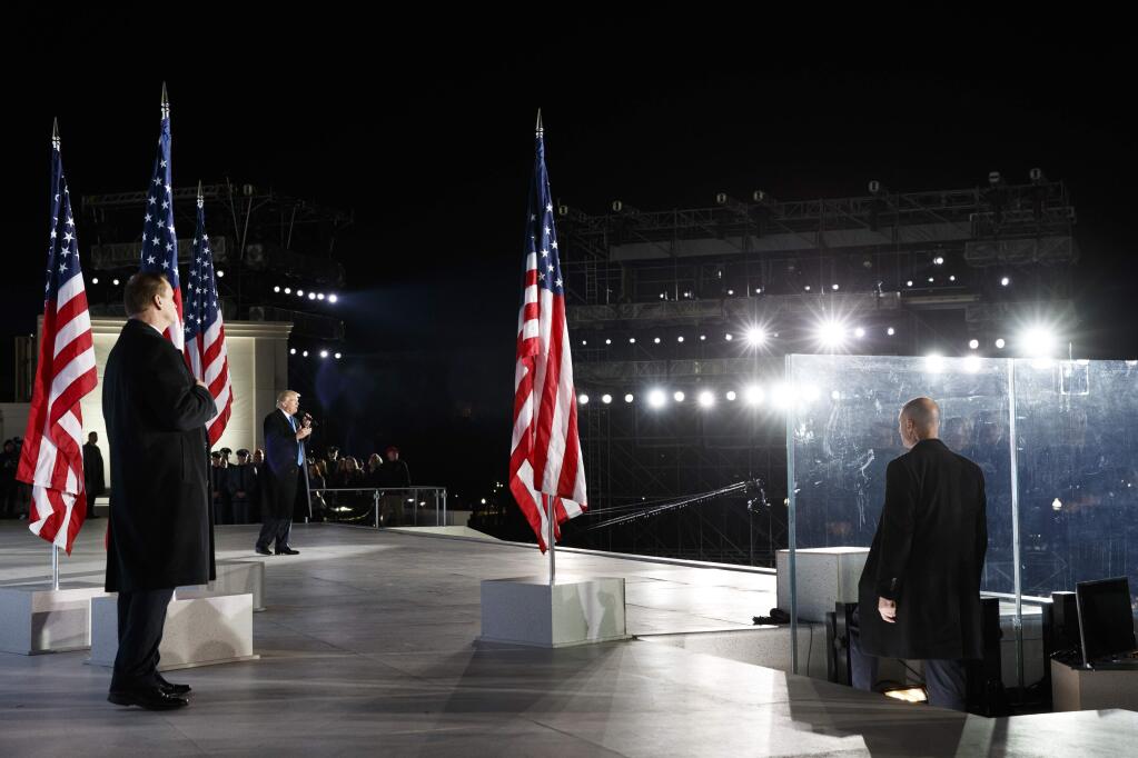 FILE - In this Jan. 19, 2017, file photo, then- President-elect Donald Trump speaks during the 'Make America Great Again Welcome Concert' at the Lincoln Memorial in Washington. When President Donald Trump's inaugural committee raised an unprecedented $107 million for a ceremony that officials promised would be “workmanlike,” the committee pledged to give leftover funds to charity. Nearly eight months later, the group has helped pay for redecorating at the White House and the vice president's residence in Washington. But nothing has gone to charity. (AP Photo/Evan Vucci)