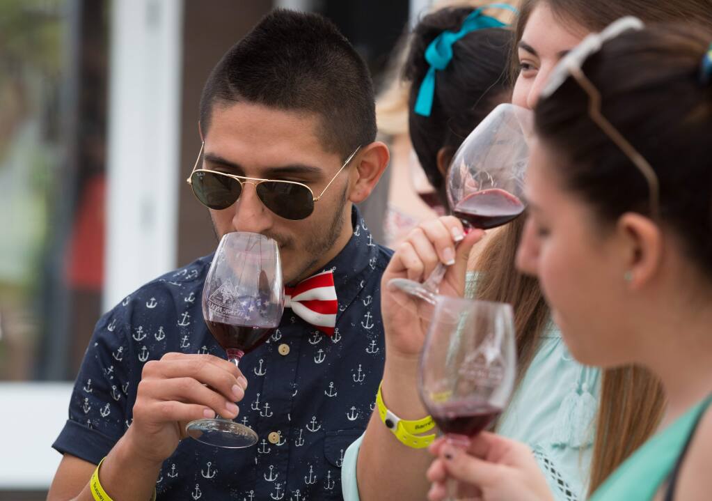 Mauricio Fernandez samples a glass of wine at the Truett-Hurst Winery in Healdsburg during Wine Road Northern Sonoma County's 37th Annual Barrel Tasting in 2015. (PD FILE)