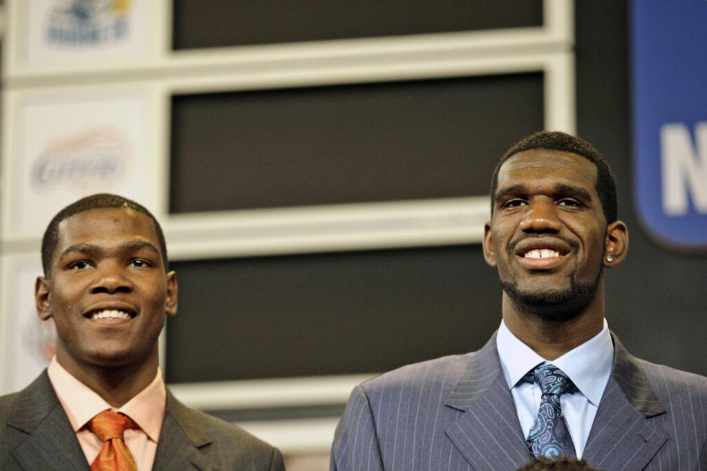 In this June 28, 2007 file photo, Texas' Kevin Durant, left, and Ohio State's Greg Oden pose before the 2007 NBA Draft in New York. Truth be told, Golden State's coach wasn't sure the Warriors needed Kevin Durant. Don Nelson thought the Warriors needed Greg Oden. (AP Photo/Kathy Willens, File)