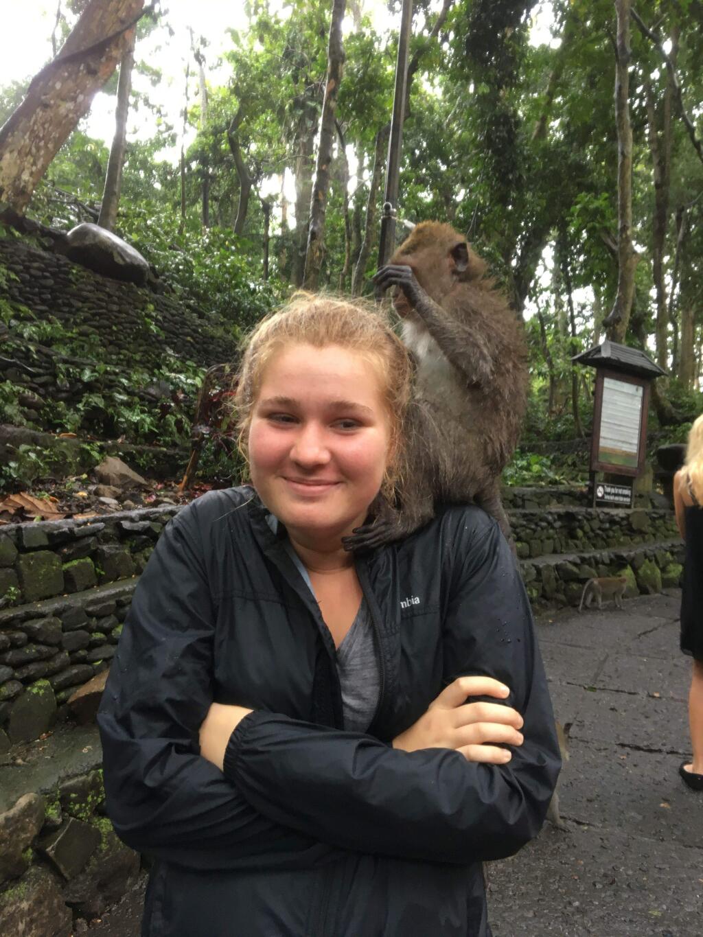 Bella Martin with a new monkey friend in Bali.