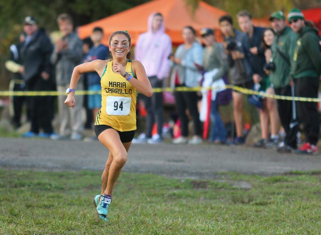 Maria Carrillo's Sydnie Rivas is all smiles as she wins the NBL Cross Country League Championships at Spring Lake Regional Park, in Santa Rosa on Friday, November 10, 2017. (Christopher Chung/ The Press Democrat)