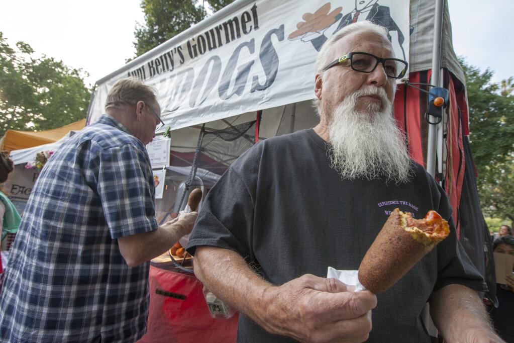 Corn dogs may not be healthy, natural or unusual, but they'll be back this year because market organizers see them as a farmer's market staple. (Photos by Robbi Pengelly/Index-Tribune)