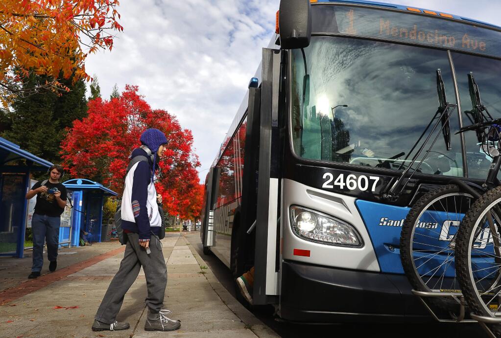 Santa Rosa Junior College student Lewis Williams boards a Santa Rosa CityBus in front of the campus on Mendocino Avenue, in Santa Rosa on Monday, November 26, 2018. SRJC students showing a validated SRJC CubCard can ride the CityBus, Petaluma Transit, and Sonoma County Transit free of charge.(Christopher Chung/ The Press Democrat)