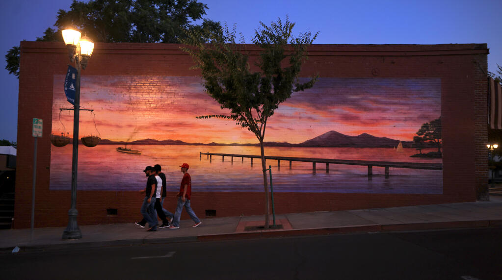 “Clear Lake Sunrise” painted by muralist Gloria De La Cruz, is located just off North Main Street in Lakeport, adjacent to Library Park. (Kent Porter / The Press Democrat)