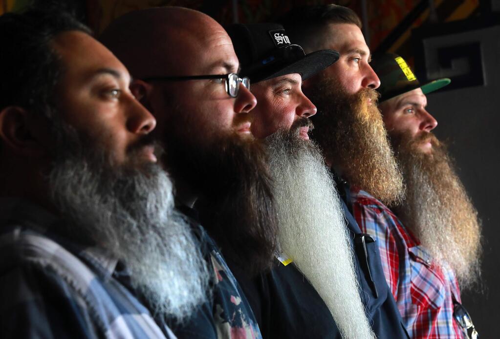 From left, Jose Casanova, Colin Power, John Abraham, Jake Barngraff and Adam Umphress show off their hairy chins at the 59th annual Whiskerino, a contest for the hirsute, at The Phoenix Theater in Petaluma. (photo by John Burgess/The Press Democrat)