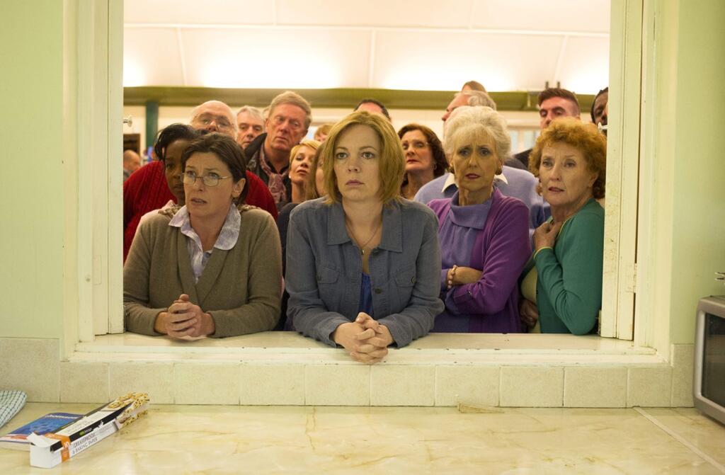 Olivia Colman, center, as Julie in 'London Road,' a musical about a series of murders that took place in Ipswitch, U.K., in 2006. (BBC Worldwide)