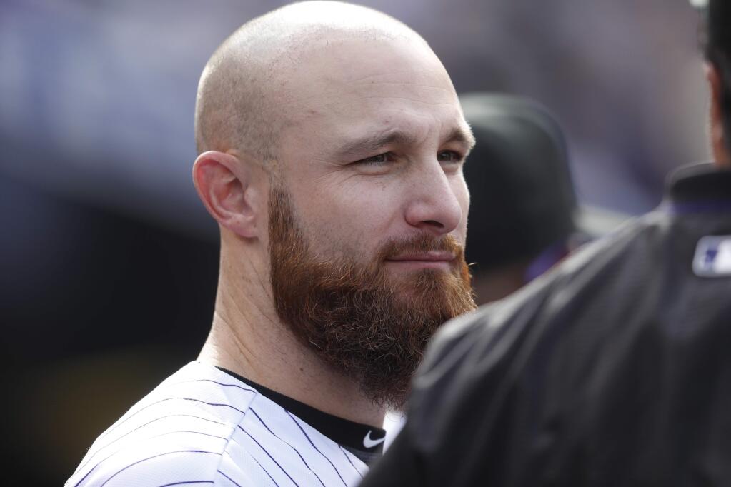 Colorado Rockies catcher Jonathan Lucroy (21) in the fourth inning of a baseball game Sunday, Oct. 1, 2017, in Denver. The Dodgers won 6-3. (AP Photo/David Zalubowski)