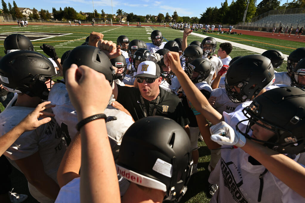Head Coach Dean “DJ” Sexton with his players during practice at Windsor High School in Windsor, Calif., on Thursday, August 11, 2022.(Erik Castro / For The Press Democrat)