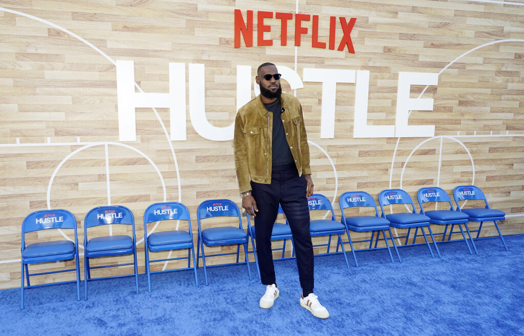 NBA basketball player LeBron James, a producer of the Netflix film "Hustle," poses at the premiere of the film, Wednesday, June 1, 2022, at the Regency Village Theatre in Los Angeles. (AP Photo/Chris Pizzello)