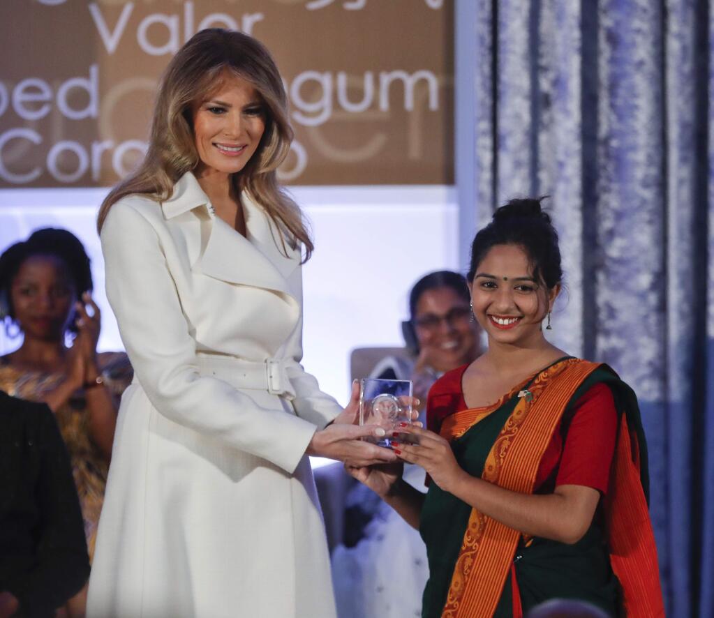 First lady Melania Trump presents the 2017 Secretary's of State's International Women of Courage (IWOC) Award to Sharmin Akter, from Bangladesh, Wednesday, March 29, 2017, at the State Department in Washington. (AP Photo/Pablo Martinez Monsivais)