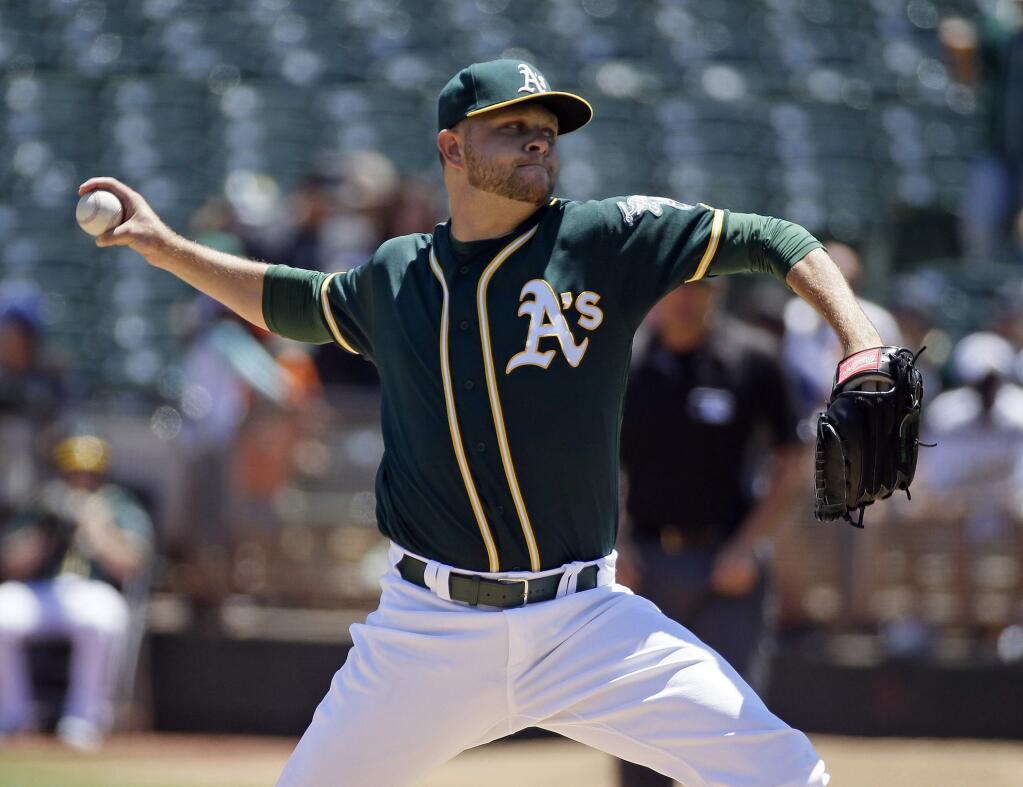 Oakland Athletics starting pitcher Jesse Hahn throws against the Tampa Bay Rays in the first inning of a baseball game Sunday, July 24, 2016, in Oakland, Calif. (AP Photo/Eric Risberg)