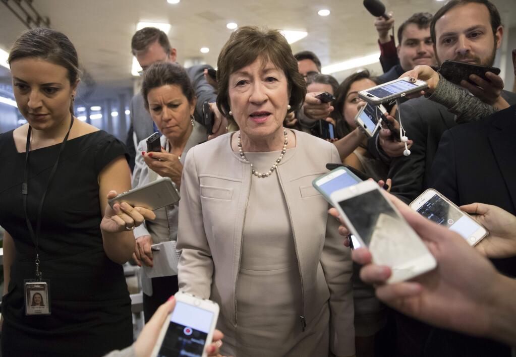 Sen. Susan Collins, R-Maine is surrounded by reporters as she arrives on Capitol Hill in Washington, Tuesday, July 25, 2017, before a test vote on the Republican health care bill. The bill has faced opposition and challenges within the Republican ranks, including by Collins. (AP Photo/J. Scott Applewhite)