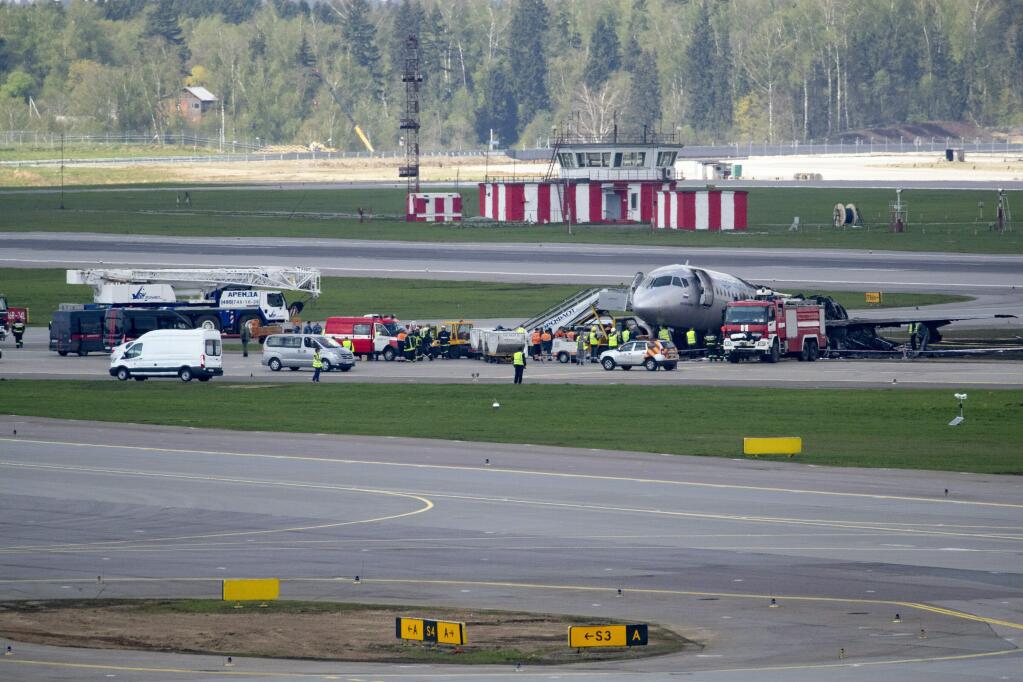 The Sukhoi SSJ100 aircraft of Aeroflot Airlines, after making an emergency landing in Sheremetyevo airport, outside Moscow, Russia, Monday, May 6, 2019. Russia's main investigative body says both flight recorders have been recovered from the plane that caught fire while making an emergency landing at Moscow's Sheremetyevo Airport, killing at least 40 people. (AP Photo/Pavel Golovkin)