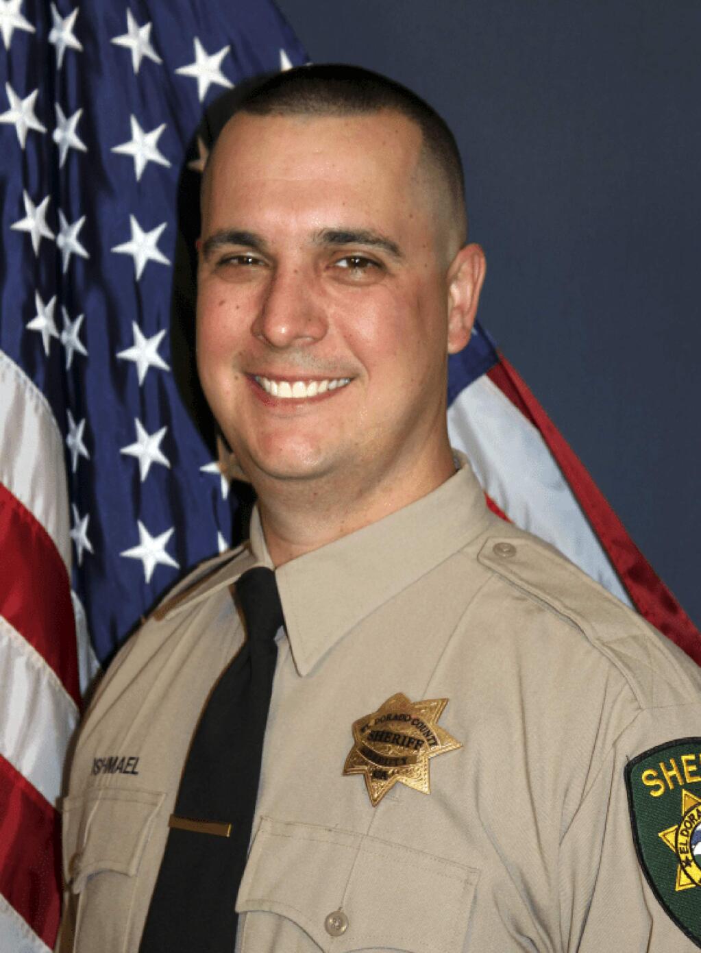 FILE - This undated file photo provided by the El Dorado County Sheriff's Office shows Deputy Brian Ishmael. Thousands of friends, colleagues and family remembered a Northern California sheriff's deputy killed in October while responding to a call about a theft from a marijuana garden as a devoted father and a committed deputy. The Sacramento Bee reports more than 3,000 people attended a service Tuesday, Nov. 5, 2019, in honor of El Dorado County Deputy Brian Ishmael at a church in Roseville. (El Dorado County Sheriff's Office via AP, File)