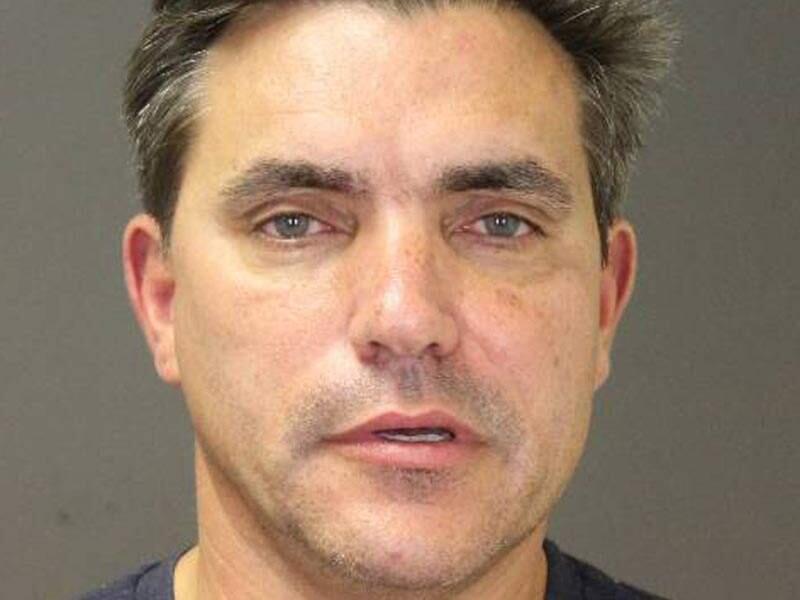 This photo provided by the Southampton Town Police Department on Long Island shows celebrity chef Todd English, 54, after his arrest early Sunday morning, Aug 31, 2014 in Southampton, N.Y., where he was charged with driving while intoxicated.(AP Photo/Southampton Town Police Department)