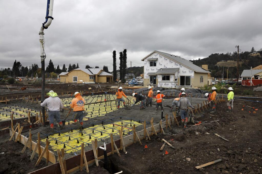 Employees of CVC Concrete pour a foundation for a home being built by Stonefield Development in Mark West Estates in Larkfield-Wikiup on Thursday, October 4, 2018. (Beth Schlanker/ The Press Democrat)